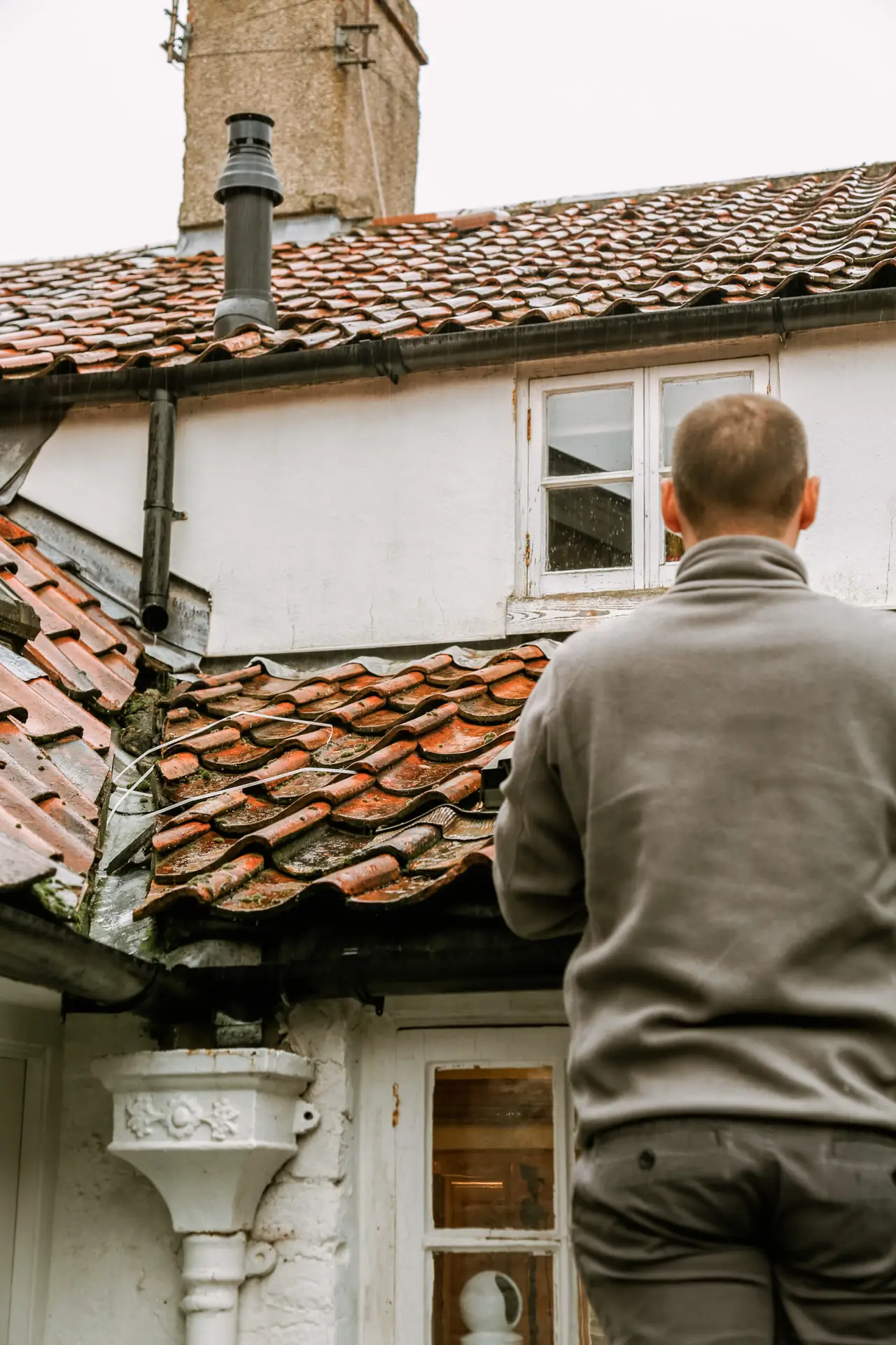 A surveyor inspecting a roof